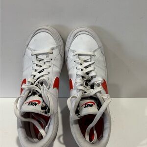 Nike White and Orange platform sneakers with cheetah print tongue